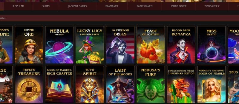 The games page of Cherry Gold Casino displays a selection of slot games, such as Tut’s Spirit, Lady of the Woods, and more.