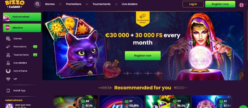 This is the landing page for Bizzo, which features several graphics, including a dark cat with yellow eyes and a fortune teller.